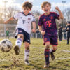 Bayern Munich Away and Third Gift Pack Kids Football Kits 26/27 - boys wearing kids football kits on UK pitch