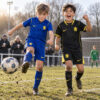 Chelsea Home and Away Gift Pack Kids Football Kits 26/27 - boys wearing kids football kits on UK pitch