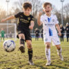 Manchester City Away and Third Gift Pack Kids Football Kits 26/27 - boys wearing kids football kits on UK pitch