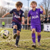 Tottenham Hotspur Away and Third Gift Pack Kids Football Kits 26/27 - boys wearing kids football kits on UK pitch